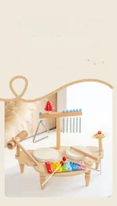 Detailed view of kids wooden musical station with colorful xylophone and drums