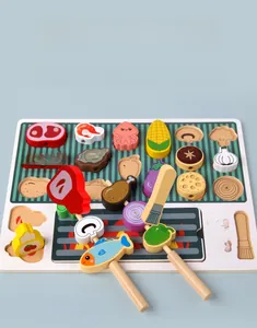Detail of wooden BBQ playset featuring colorful toy food items and base tray
