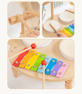 Macro detail of wooden musical toy set with colorful xylophone keys and mini drums