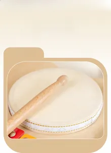 Detail of premium goatskin hand drum and wooden drumstick for children's music toy