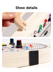 Detailed view of LED lights and toggle switches on a wooden Montessori busy board toy