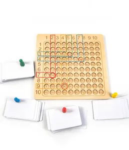 Close-up of wooden Montessori multiplication board with colored pegs and math cards