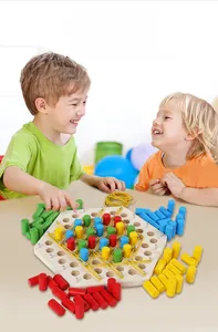 Children playing with a wooden hexagonal logic chain board game with colored pegs