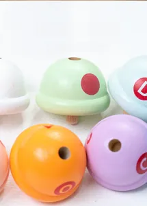 Close-up of wooden macaron toy blocks with letters and non-toxic water-based paint