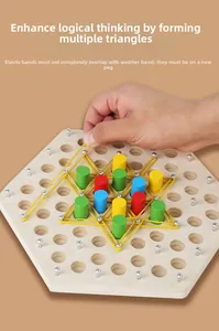 Detail of wooden chain triangle board game with hands placing elastic bands on pegs