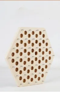 Detailed close-up of hexagonal wooden board with sturdy metal pegs for strategy game