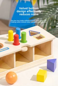 Detail view of wooden shape sorter box with colorful blocks and noise-reducing yellow felt