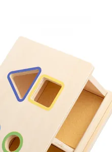 Detailed close-up of Montessori wooden toy box showing smooth geometric shape cutouts