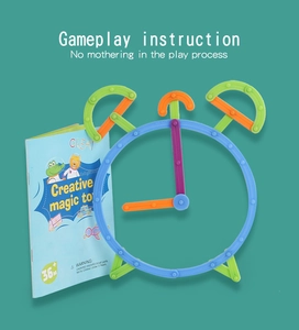 Detail showing colorful plastic building sticks assembled into a clock shape with manual