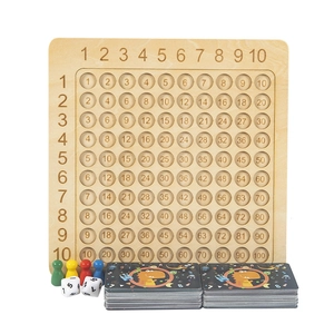 Wooden 10x10 multiplication board set with colorful pawns, dice and dinosaur cards