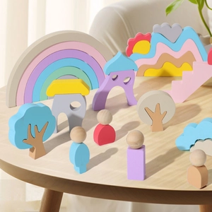 Pastel wooden rainbow blocks set with mountains and trees for early childhood learning