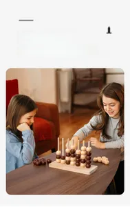Two girls playing wooden 4-in-a-row board game on a table in a warm home setting