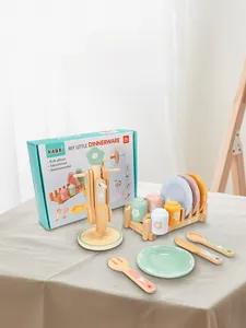 Detail of wooden play kitchen toy set with colorful cups and plates on a drying rack