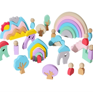 Colorful wooden rainbow stacking blocks and nature-themed toy set for early learning