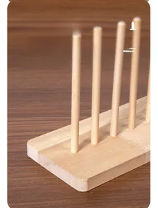 Macro detail of thickened solid wood base and sturdy vertical pegs for four piece board game