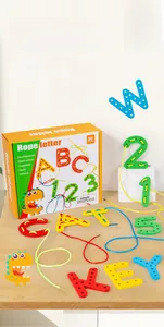 Macro view of wooden letters and threading ropes for fine motor skills training