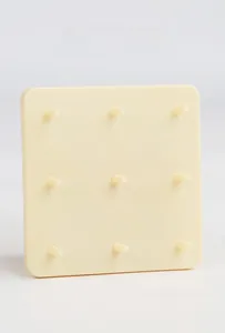 Detail of sturdy beige 3x3 grid pegboard base with smooth rounded plastic pillars