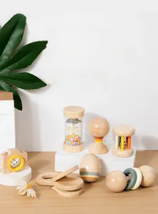 Detailed set of natural wooden baby rattles including maracas and camera toy for grip training