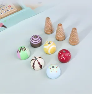 Detail of wooden ice cream play set with colorful scoops and waffle cones on blue background