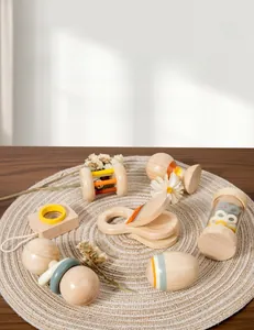 Detailed view of Morandi-toned wooden baby rattle set for sensory grip training