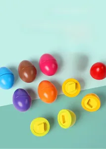 Macro shot of colorful toddler matching eggs showing internal geometric shape connectors