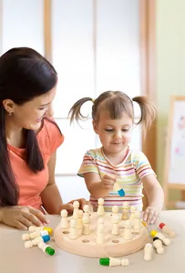Family playing memory chess with colorful wooden pieces on a round board detail
