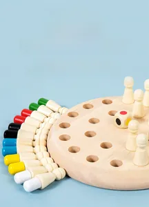 Detailed view of colorful wooden memory chess pieces and a round board on blue background