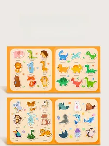 Detail view of educational quiet book featuring colorful animal stickers and English vocabulary