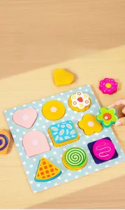 Macro shot of wooden double-layered cookies toy with matching base for toddler shape recognition