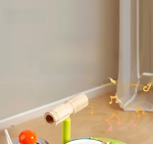 Close-up of wooden music table toy featuring polished percussion parts and green stand