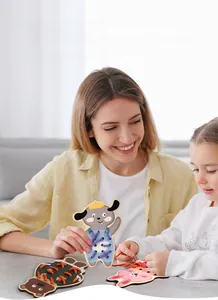 Mother and daughter playing with wooden animal threading toys for fine motor skills