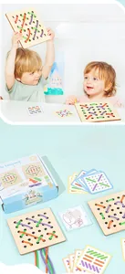 Detail of wooden threading board set with colored ropes and guide cards for toddlers