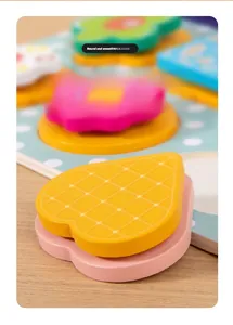 Close-up of smooth, rounded wooden puzzle pieces with colorful eco-friendly paint finish