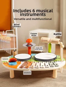 Detail of wooden 6-in-1 musical toy table with xylophone, drums, and metal wind chimes