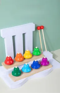 Close-up of 8-note rainbow percussion bells on a solid wood base with two wooden mallets