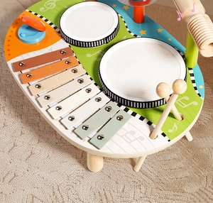 Macro shot of wooden musical activity table with xylophone and drums for kids