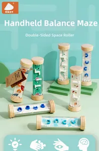 Close-up of wooden handheld balance maze toy showing multilayer paths and rolling ball detail