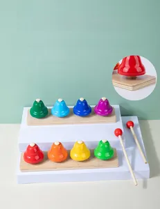 Detail of 8-note rainbow metal bells with wooden base and safe rounded corners for kids