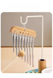 Detail of 8-tube metal wind chime with wooden beam and mallet for kids music