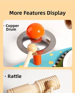 Close-up of metal cymbal and wooden percussion mallet on multi-functional toy drum set