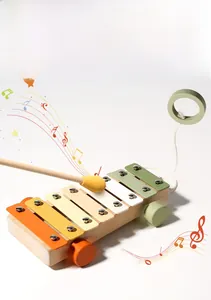 Detail of wooden 2-in-1 xylophone pull-along toy with colorful keys and natural wood base
