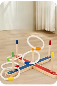 Detail of wooden ring toss game with colorful scoring pins and woven rope loops