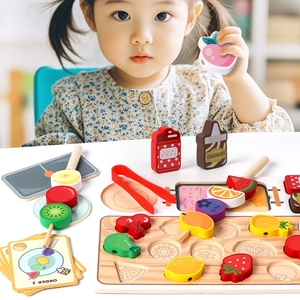Toddler playing with wooden fruit skewer toy set and order cards for motor skills