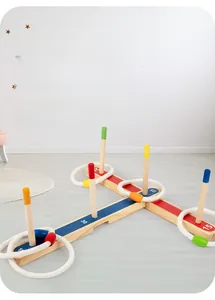 Detailed view of kids wooden ring toss game with score markings and colorful posts