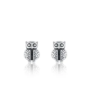 Minimalist S925 sterling silver owl stud earrings with oxidized feather detail