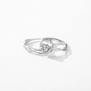 Elegant Mobius S925 sterling silver ring set with round cut zircon and twisted band