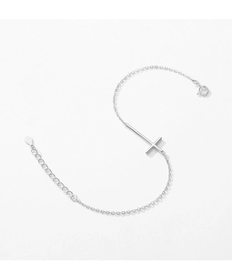 Macro detail of silver cross bracelet with adjustable link chain and spring clasp
