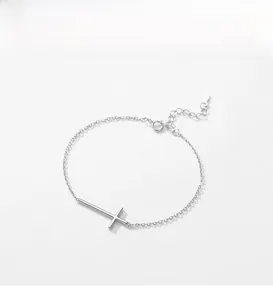 Detailed close-up of s925 sterling silver cross bracelet with polished cross pendant