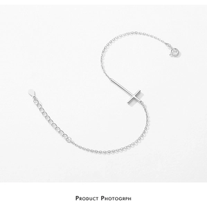Detailed view of S925 sterling silver cross bracelet with fine O-chain and lobster clasp