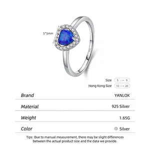 S925 sterling silver heart-shaped blue opal ring with halo diamonds on white background